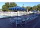 Community pool area with tables, chairs, and umbrellas at 283 Pelican N Dr, Oldsmar, FL 34677