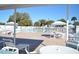 Relaxing community pool area with patio furniture at 283 Pelican N Dr, Oldsmar, FL 34677