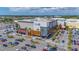 Large aerial view of the Cobb 12 movie theater, showcasing its central location and ample parking spaces at 2085 Hunters Glen Dr # 213, Dunedin, FL 34698