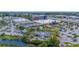 Aerial view of a vibrant shopping center with ample parking and a variety of retail and dining options at 2085 Hunters Glen Dr # 213, Dunedin, FL 34698