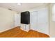 Bright bedroom featuring wood floors, closet space, and a window, perfect for relaxation at 707 2Nd Se St, Largo, FL 33771