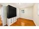 Simple bedroom with wood floors, a spacious closet, and a window for natural light at 707 2Nd Se St, Largo, FL 33771