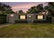 Exterior view of house with a manicured lawn and nice landscaping at 707 2Nd Se St, Largo, FL 33771