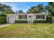 Charming single-story home with well-manicured lawn and trimmed hedges at 707 2Nd Se St, Largo, FL 33771