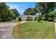 Cozy home with a neatly kept lawn and a convenient attached garage at 707 2Nd Se St, Largo, FL 33771