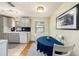 Bright kitchen dining area with gray cabinets and ample sunlight at 707 2Nd Se St, Largo, FL 33771