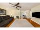 Open-concept living room connecting to the kitchen with hardwood floors at 707 2Nd Se St, Largo, FL 33771