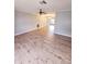 Open living room featuring wood-look floors and a ceiling fan at 8356 Candlewood Rd # 0, Seminole, FL 33777