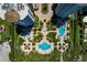 Aerial view of condos with mature landscaping, pools, and beach access at 1170 Gulf Blvd # 1005, Clearwater Beach, FL 33767