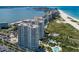 Aerial view of tall beachfront condos with pools and tennis courts at 1170 Gulf Blvd # 1005, Clearwater Beach, FL 33767