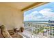 Enjoy breathtaking water views from this condo's private balcony with tile flooring and comfortable seating at 1170 Gulf Blvd # 1005, Clearwater Beach, FL 33767