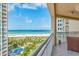 Enjoy breathtaking ocean views from the private balcony with seating, overlooking a pool and beach at 1170 Gulf Blvd # 1005, Clearwater Beach, FL 33767