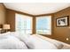 Comfortable bedroom features tiled floors, large windows, and white bedding at 1170 Gulf Blvd # 1005, Clearwater Beach, FL 33767