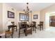 Chic dining room with a modern chandelier, seating for five and tiled floors at 1170 Gulf Blvd # 1005, Clearwater Beach, FL 33767