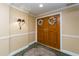 The entryway is decorated with double doors, carpet, and sconce lighting at 1170 Gulf Blvd # 1005, Clearwater Beach, FL 33767