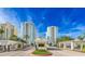 Luxury high-rise condos with gated entrance, lush landscaping, and secure access at 1170 Gulf Blvd # 1005, Clearwater Beach, FL 33767