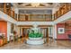 Elegant lobby featuring a water fountain, high ceilings, and a second-story balcony overlooking the entrance at 1170 Gulf Blvd # 1005, Clearwater Beach, FL 33767