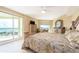 Serene main bedroom features access to the balcony and a tranquil water view at 1170 Gulf Blvd # 1005, Clearwater Beach, FL 33767