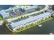 Aerial view of the condo building, parking and waterfront access at 1893 Shore S Dr # 206, South Pasadena, FL 33707