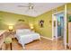 Bedroom with wood flooring and access to bathroom at 1893 Shore S Dr # 206, South Pasadena, FL 33707