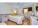 Well-lit bedroom featuring wood floors and a comfy bed at 1893 Shore S Dr # 206, South Pasadena, FL 33707