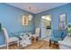 Dining room with glass table and hardwood floors, view into kitchen at 1893 Shore S Dr # 206, South Pasadena, FL 33707