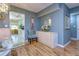 Dining room with glass table, light blue walls, and hardwood floors at 1893 Shore S Dr # 206, South Pasadena, FL 33707