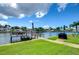 Private dock with seating area, offering waterfront access and stunning canal views at 1893 Shore S Dr # 206, South Pasadena, FL 33707
