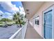 Condo hallway with light-colored walls and white railings at 1893 Shore S Dr # 206, South Pasadena, FL 33707