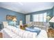 Living room with light blue walls, wood floors, and sofas at 1893 Shore S Dr # 206, South Pasadena, FL 33707