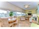 Waterfront living room with comfortable seating and dining area at 1893 Shore S Dr # 206, South Pasadena, FL 33707