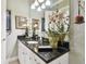 Bathroom with granite countertop and large mirror at 23 Concord Dr, Dunedin, FL 34698