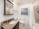 Bathroom with granite countertop, updated fixtures, and a shower/tub at 2827 29Th N Ave, St Petersburg, FL 33713