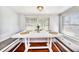 Bright dining area with white table and built-in bench seating at 2827 29Th N Ave, St Petersburg, FL 33713