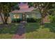 House exterior at dusk, showcasing landscaping at 2827 29Th N Ave, St Petersburg, FL 33713