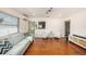 Open living room with hardwood floors and a view of the kitchen at 2827 29Th N Ave, St Petersburg, FL 33713