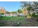 View of the backyard showing the house and the outdoor fire pit at 219 6Th Sw Ave, Largo, FL 33770
