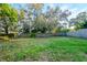 Expansive backyard with a mix of grass and shaded areas at 219 6Th Sw Ave, Largo, FL 33770