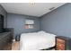 Simple bedroom with double bed and dark wood furniture at 219 6Th Sw Ave, Largo, FL 33770