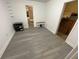 Neutral bedroom featuring gray wood-look floors and a small closet at 219 6Th Sw Ave, Largo, FL 33770