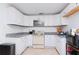 Clean kitchen featuring white cabinets and granite counters at 219 6Th Sw Ave, Largo, FL 33770