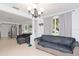 Spacious living area with two sofas and view into kitchen at 219 6Th Sw Ave, Largo, FL 33770