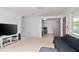 Living room with a large TV and open kitchen view at 219 6Th Sw Ave, Largo, FL 33770