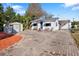 House exterior showcasing a brick driveway, shed, and landscaping at 4631 42Nd N Ave, St Petersburg, FL 33714