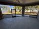 Bright screened porch with view of backyard at 15151 Eastwood Trl, Brooksville, FL 34604