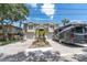Lovely two-story home featuring a double garage, RV parking, manicured landscaping and brick paver driveway at 435 Westwinds Drive, Palm Harbor, FL 34683
