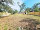 Large backyard with a wooden fence at 1345 Young Ave, Clearwater, FL 33756