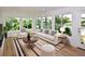 Bright and airy living room with large windows overlooking a scenic lake view at 903 San Carlos Ne Ave, St Petersburg, FL 33702