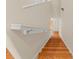 Clean, modern staircase with wooden steps and white railing at 123 99Th Ave, Treasure Island, FL 33706