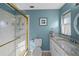 Clean bathroom with granite vanity, shower, and tile flooring at 7030 Lafayette N, Pinellas Park, FL 33781